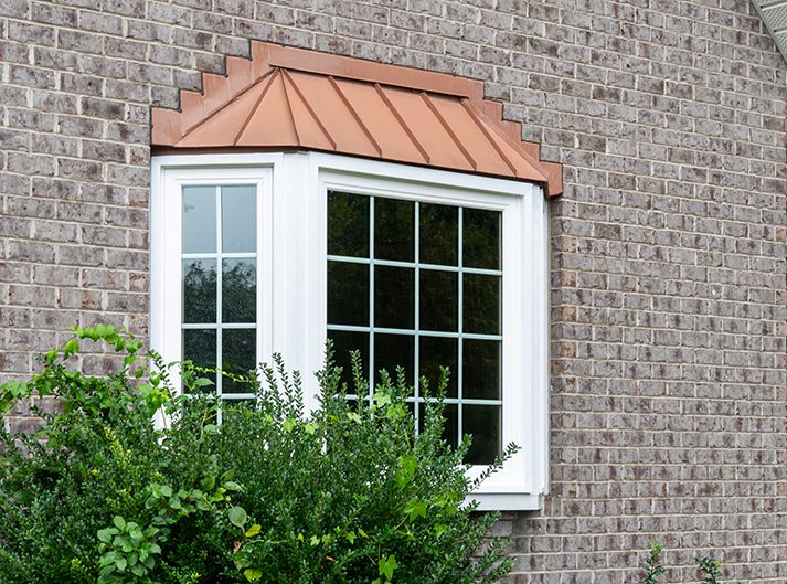 Vytex bay window with a copper standing-seam roof