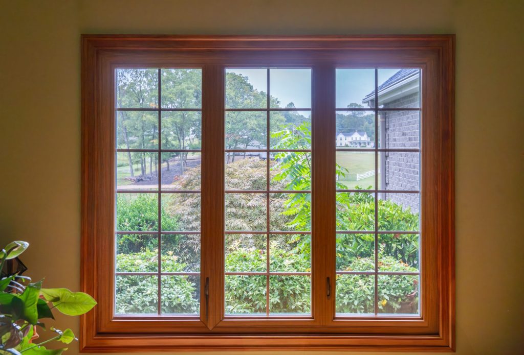 Bank of Vytex casement windows with woodgrain interior and grids
