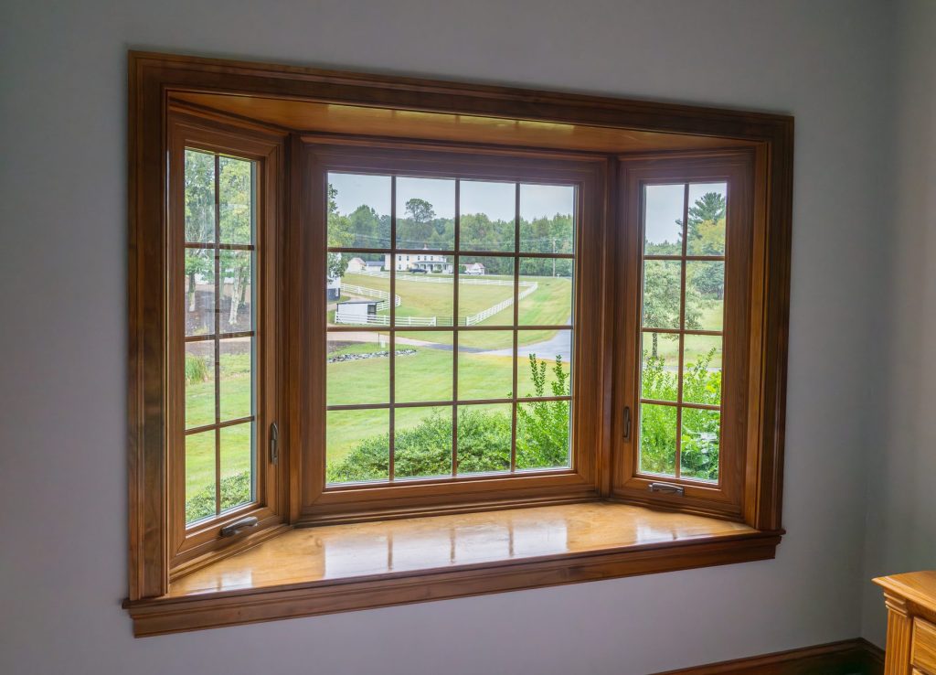 Vytex woodgrain casement bay window with colonial grids