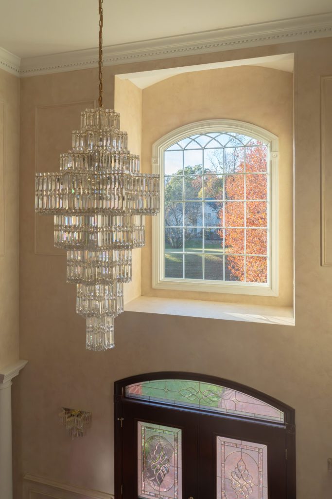 Vytex Fortis arched window with chandelier in a nursery