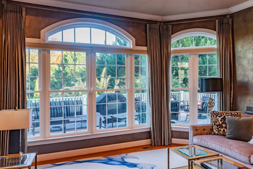 Vytex Fortis bay window in a sunroom with wood trim