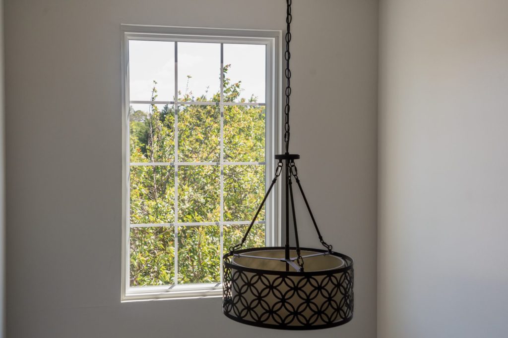 Interior view of a Vytex Fortis white double-hung window with grids