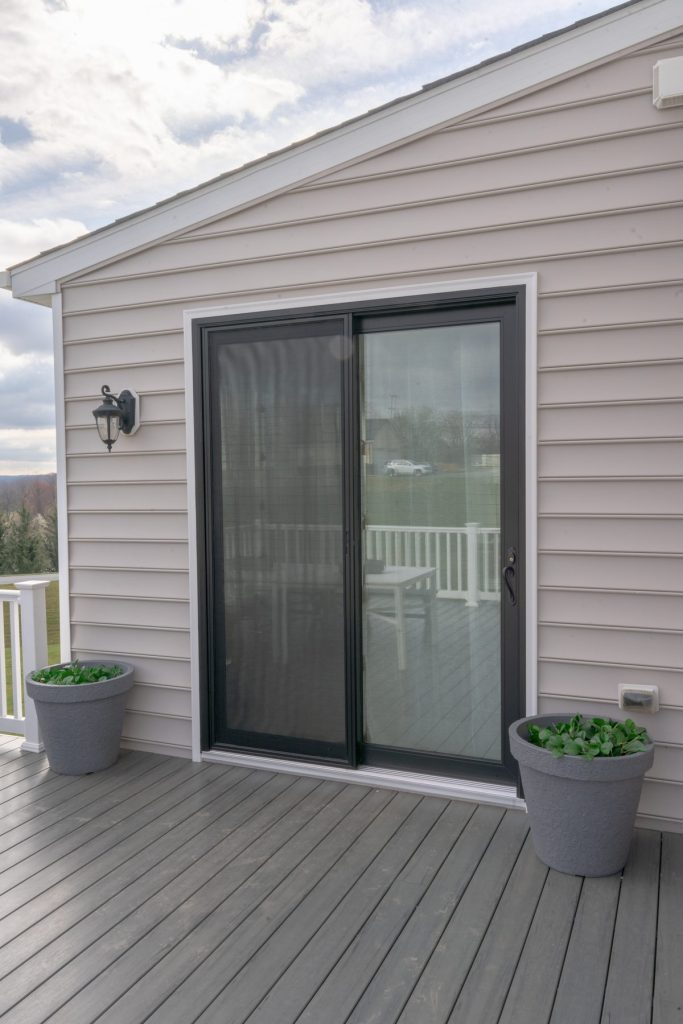 Vytex Signature Series True Black patio door on a deck