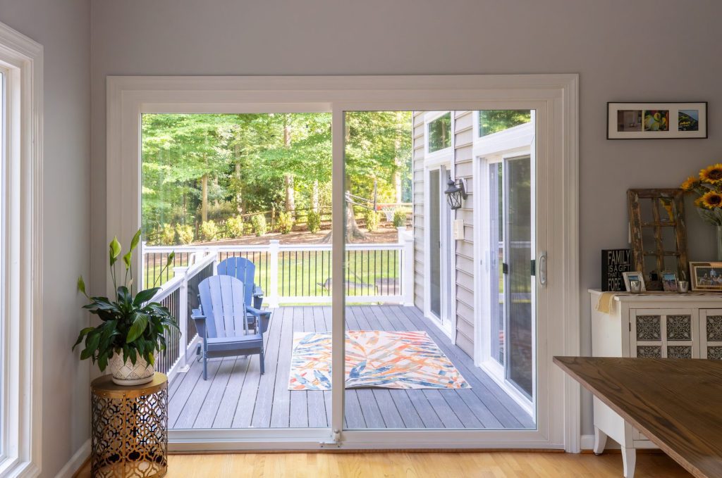 Vytex 7000 Series sliding patio door in a dining area with a view of the deck
