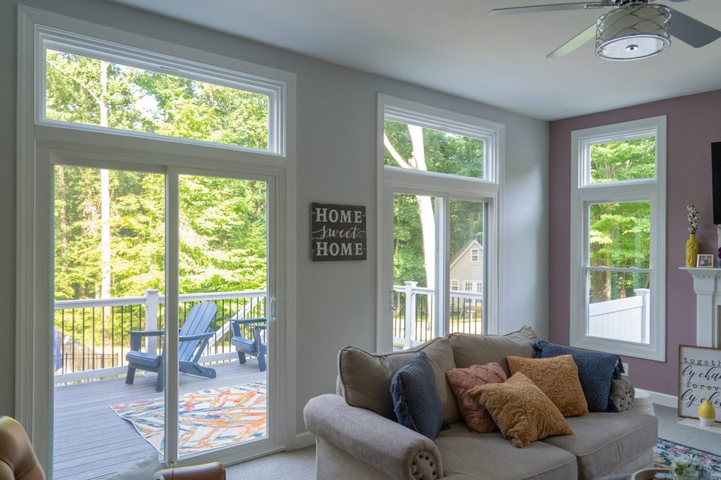 Vytex 7000 Series sliding glass patio door in a living room opening to a deck