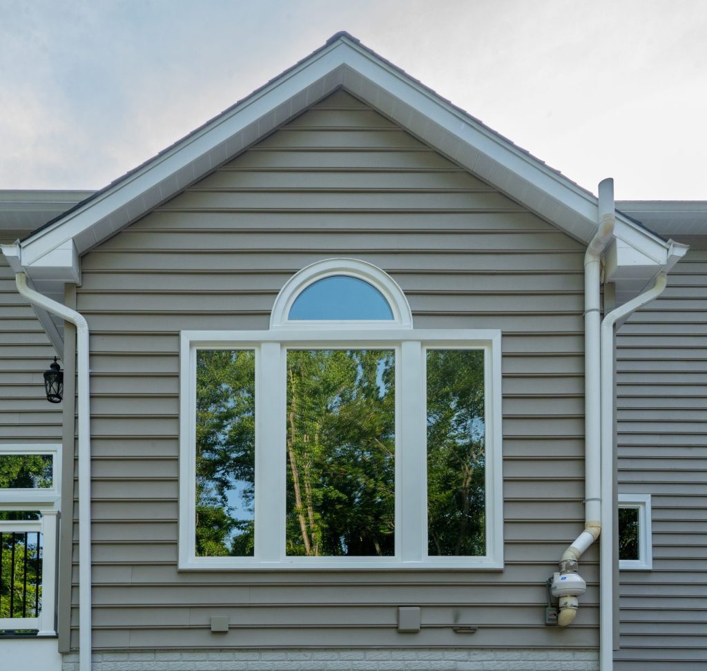 Vytex Georgetown Elite windows on a stone home